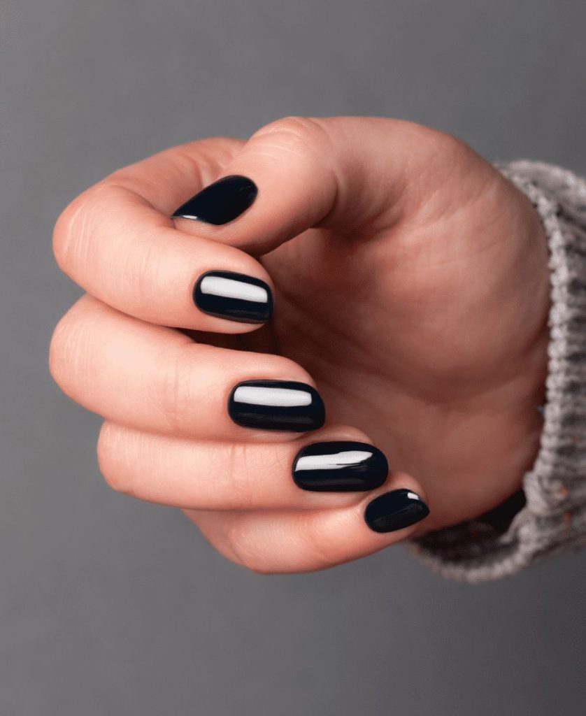 Hand showing black nail polish