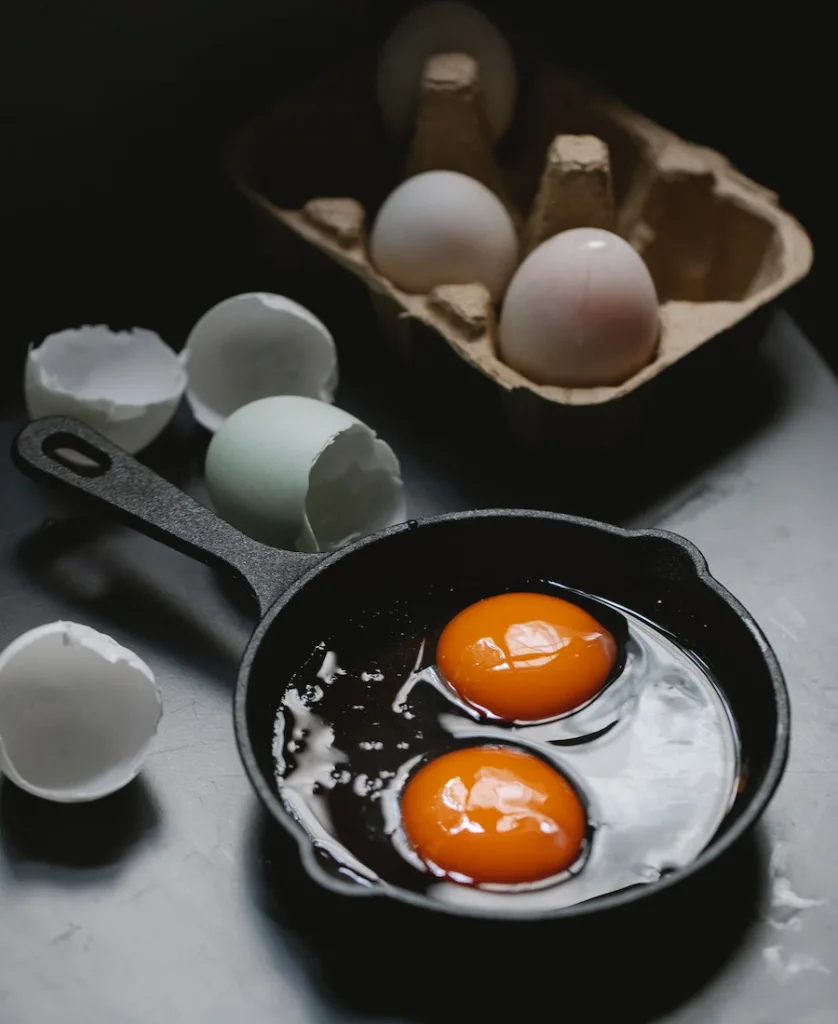 raw eggs in pan
