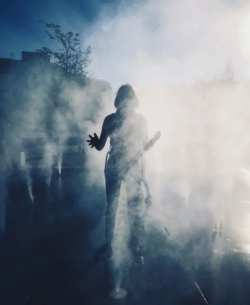 a woman in the smoke