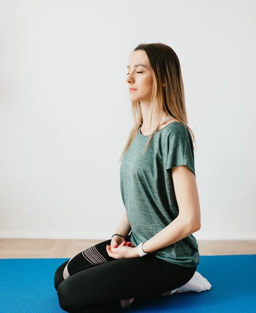 a woman sitting sleeping while doing meditation