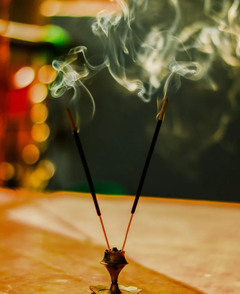 two incense sticks burning