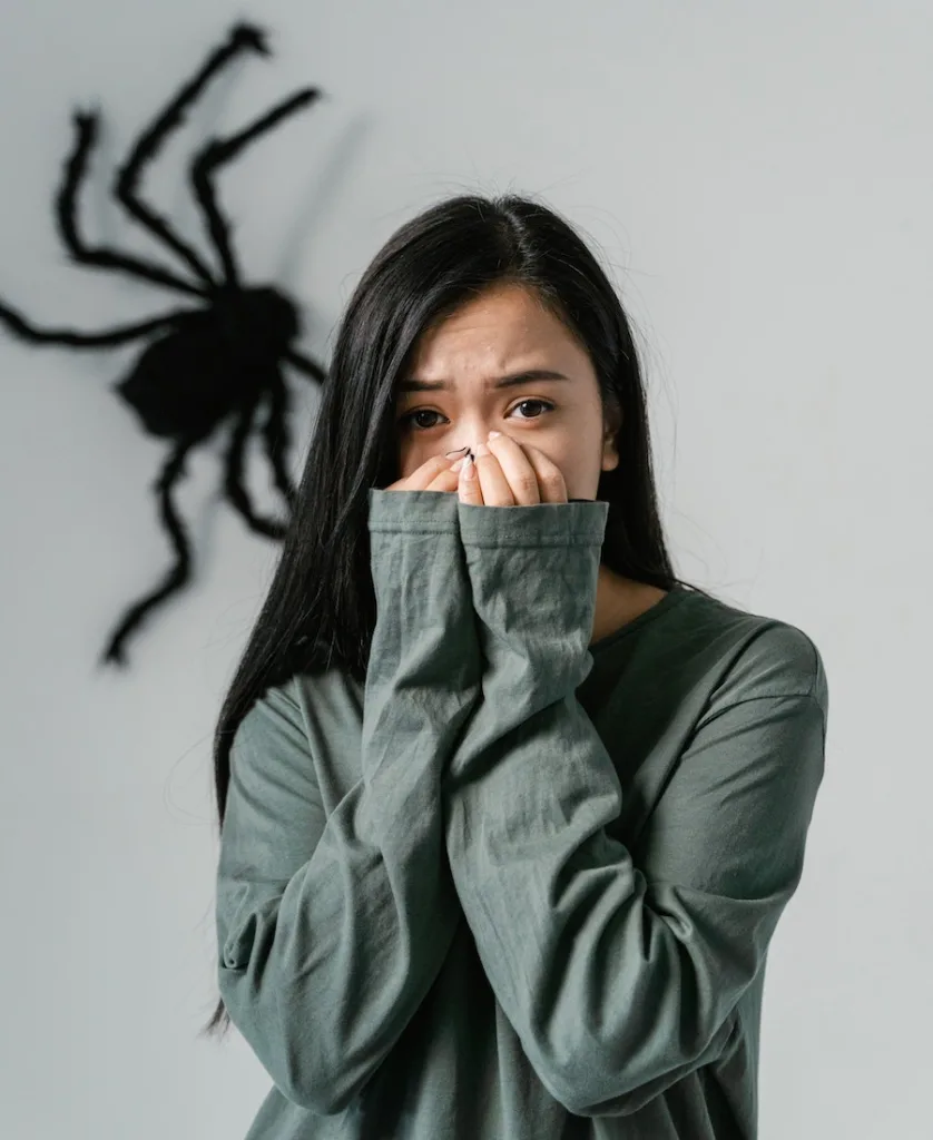woman afraid of spider