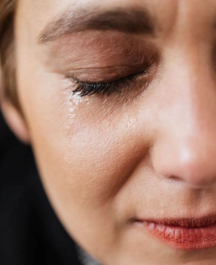 woman crying through her left eye