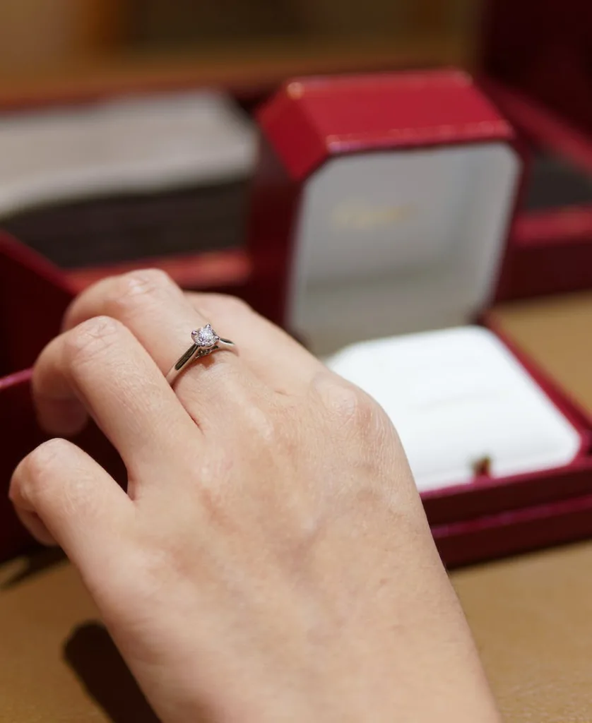 a woman wearing a ring she found